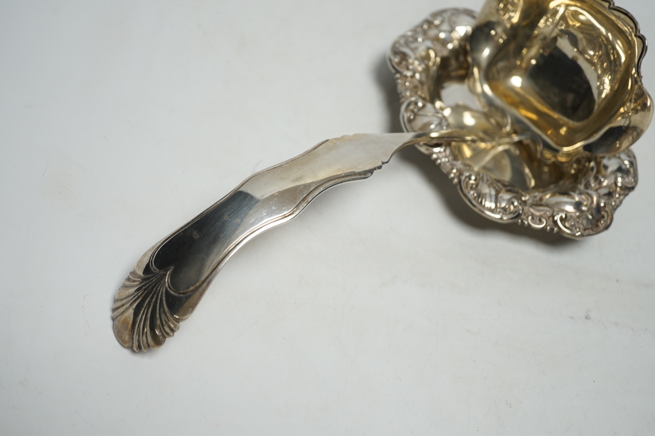 A Dutch white metal soup ladle, 29.5cm and a sterling small dish, 9.3oz.